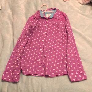 A purple shirt, with white polka dots